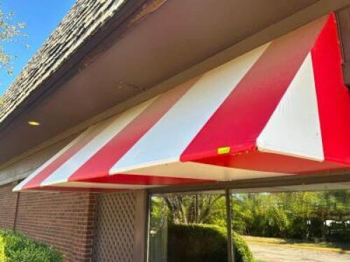 12' ALUMINUM FRAME AWNING IN RED AND WHITE STIPE VINYL WITH INTERNAL BACK LIGHTING.