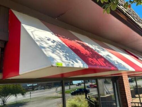 12' ALUMINUM FRAME AWNING IN RED AND WHITE STIPE VINYL WITH INTERNAL BACK LIGHTING.