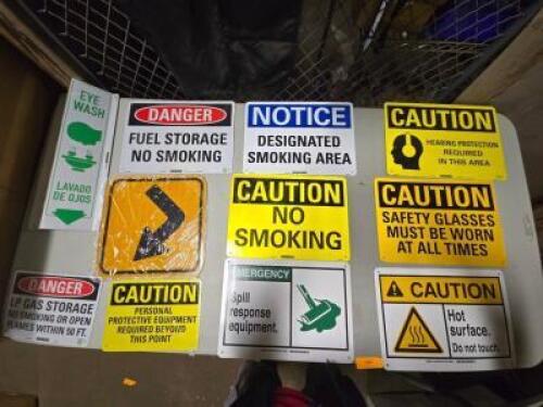 DESCRIPTION: (1) TABLE OF VARIOUS SIGNS QTY: 1