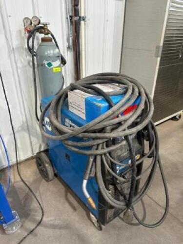 MILLERMATUC 212 AUTO SET WELDER W/ LEADS, TORCH, AND CYLINDER TANK.