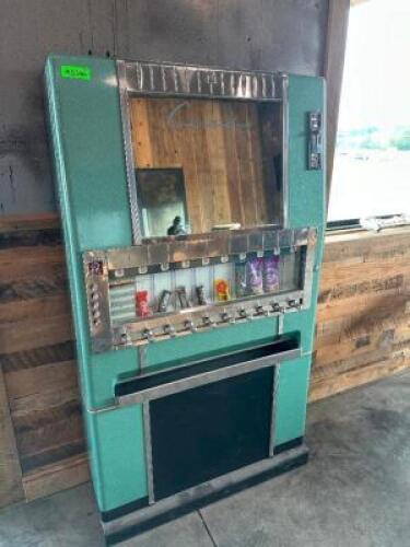 VINTAGE CANDY VENDING MACHINE WITH TEAL ENAMEL CABINET AND CHROME TRIM. FEATURES MULTIPLE PUSH PULL CANDY SELECTION LEVERS, COIN SLOT, AND RETRO DESIGN