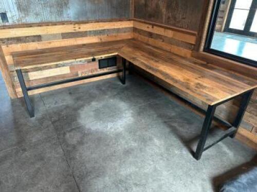 L SHAPED WORKSTATION DESK CRAFTED FROM RECLAIMED SOLID WOOD WITH A RUSTIC FINISH, FEATURING HEAVY GAUGE BLACK STEEL LEGS.