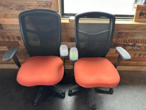 (2) BLACK OFFICE CHAIRS W/ TERRA COTTA UPHOLSTERED SEATS.