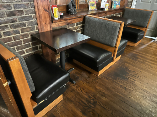 TWO SECTION 30" BOOTH SEATING W/ TABLES.