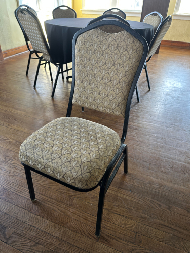 (8) TAN AND WHITE UPHOLSTERED STACK CHAIRS.