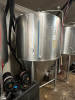 575-GALLON STAINLESS STEEL CONICAL FERMENTER WITH TOP MANWAY, RACKING ARM, SAMPLE VALVE, AND CONE DUMP. UNIT INCLUDES WELDED TRI-CLAMP FITTINGS, PRESSURE GAUGE, AND HEAVY-DUTY FRAME.