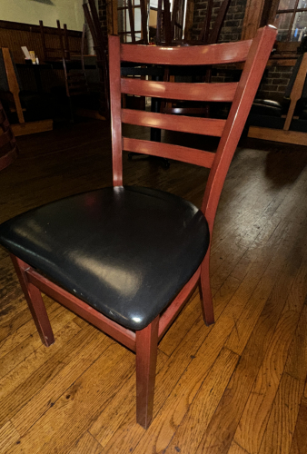 (8) LADDER BACK WOOD CHAIRS W/ BLACK PADDED SEATS.