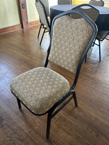 (8) TAN AND WHITE UPHOLSTERED STACK CHAIRS.