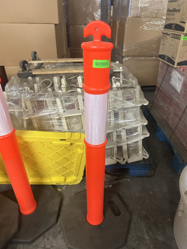(4) TALL TRAFFIC BARRIERS W/ HEAVY RUBBER BASES.