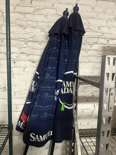 (2) ASSORTED SAM ADAMS 8' PATIO UMBRELLAS