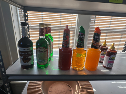 (1) LOT OF ASSORTED MIXERS AND SYRUPS.