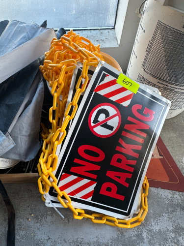 PLASTIC CHAIR AND NO PARKING SIGNS