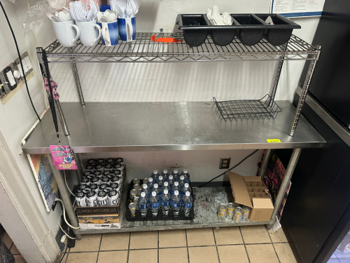 50" X 24" STAINLESS TABLE W/ WIRE RISER.