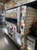 WOOD STONE CORP COMMERCIAL STONE HEARTH PIZZA OVEN WITH TILE-FACED EXTERIOR AND FRONT-LOADING DECK. DESIGNED FOR HIGH-VOLUME PIZZA AND ARTISAN BREAD BAKING, FEATURING A STONE COOKING SURFACE AND INTEGRATED CONTROL PANEL.