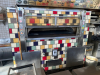 WOOD STONE CORP COMMERCIAL STONE HEARTH PIZZA OVEN WITH TILE-FACED EXTERIOR AND FRONT-LOADING DECK. DESIGNED FOR HIGH-VOLUME PIZZA AND ARTISAN BREAD BAKING, FEATURING A STONE COOKING SURFACE AND INTEGRATED CONTROL PANEL. - 10