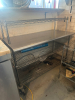 50" X 24" STAINLESS TABLE W/ WIRE RISER. - 2