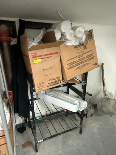 BAG AND BOX RACK W/ (2) CASES OF FOAM CUPS.