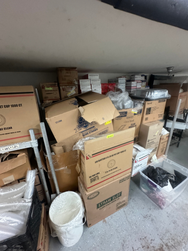 CONTENTS OF SHELF - A LARGE ASSORTMENT OF PAPER PRODUCT..