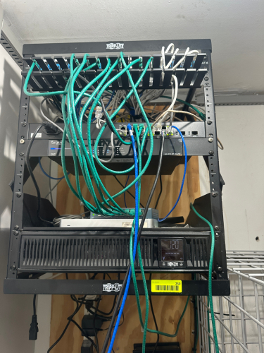 WALL MOUNTED ELECTRONICS CASE W/ CONTENTS - TRIPLITE BACK UP AND ARAKNIS OVRC UNIT