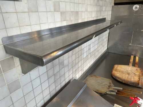 72" X 12" STAINLESS WALL SHELF.