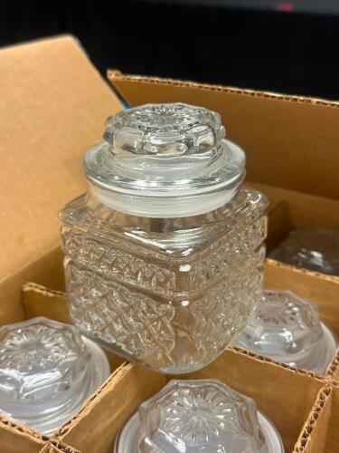 (1) CASE OF GLASS CANDY JARS W/ LIDS.