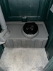 STANDARD PORTABLE RESTROOM / PORTA-POTTY WITH DURABLE MOLDED PLASTIC CONSTRUCTION DESIGNED FOR JOB SITES AND EVENTS. FEATURES INCLUDE VENTED ROOF, SECURE LOCKING DOOR, AND COMPACT FOOTPRINT FOR EASY PLACEMENT AND TRANSPORT. UNIT SHOWS NORMAL COSMETIC WEAR - 3