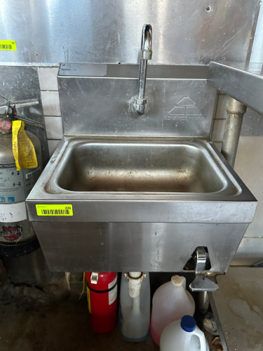 WALL MOUNTED STAINLESS HAND SINK W/ KNEE PEDAL.