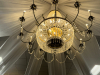 LARGE CRYSTAL CHANDELIER WITH STRANDS AND DROPLETS HANGING FROM EACH ARM. THE METAL FRAME IS GOLD-TONE - 2