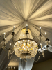 LARGE CRYSTAL CHANDELIER WITH STRANDS AND DROPLETS HANGING FROM EACH ARM. THE METAL FRAME IS GOLD-TONE - 3