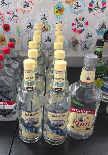 (12) BOTTLES OF BARTON SUPERIOR LIGHT RUM AND (1) BOTTLE OF McMORMICKS RUM