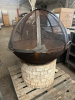 LARGE METAL OUTDOOR FIRE PIT WITH MESH SPARK SCREEN AND BRICK BASE. FEATURES HINGED MESH COVER WITH HANDLES - 2