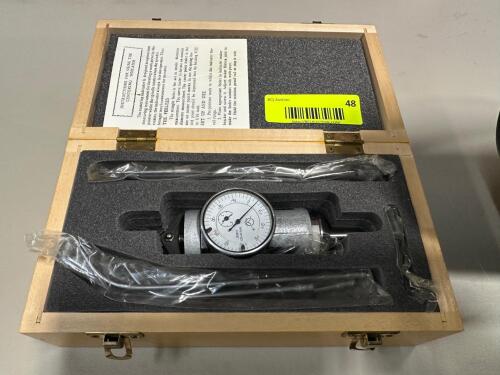 DIAL BORE GAUGE SET WITH ANALOG INDICATOR, ASSORTED EXTENSION RODS, AND FITTED WOOD STORAGE CASE.