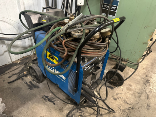 MILLER SYNCROWAVE 180 SC AC/DC WELDER W/ LEADS, GAUGES, AND HOSE.
