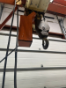 MOBILE STEEL GANTRY CRANE EQUIPPED WITH COFFING 5-TON ELECTRIC CHAIN HOIST AND HEAVY-DUTY STEEL I-BEAM. FEATURES RIGID WELDED FRAME, ROLLING CASTERS FOR SHOP MOBILITY, AND INTEGRATED POWERED HOIST WITH HOOK AND CHAIN AS SHOWN. - 7