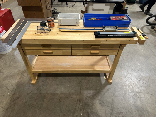 60" WOODEN FABRICATION TABLE.
