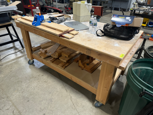 72" X 48" WOODEN FABRICATION TABLE.