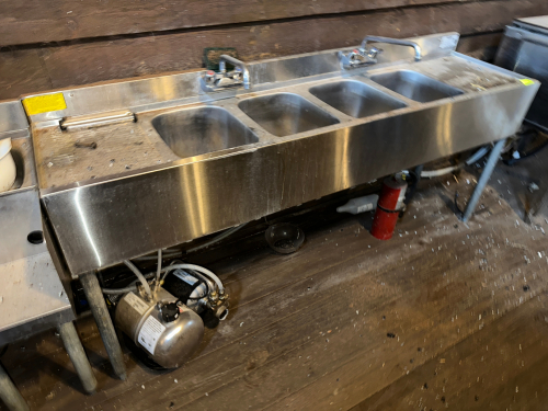 KROWNE FOUR WELL UNDER BAR STAINLESS SINK W/ LEFT AND RIGHT DRY BOARDS.