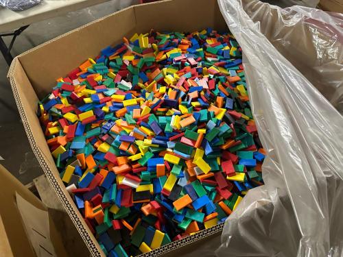 (1) GAYLORD OF 36,000 PLASTIC MULTI COLORED DOMINOS.