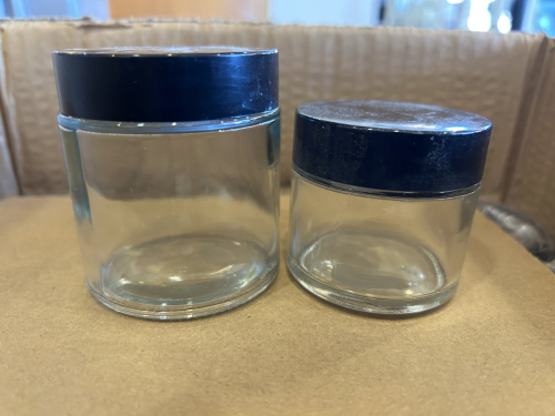 (3) BOXES OF SMALL GLASS JARS W/ LIDS.