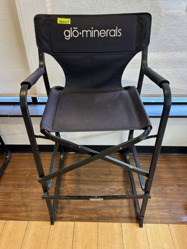 GLŌ MINERALS BRANDED DIRECTOR&rsquo;S CHAIR WITH BLACK CANVAS SEAT AND BACK, PADDED ARMRESTS, AND FOLDING METAL FRAME.