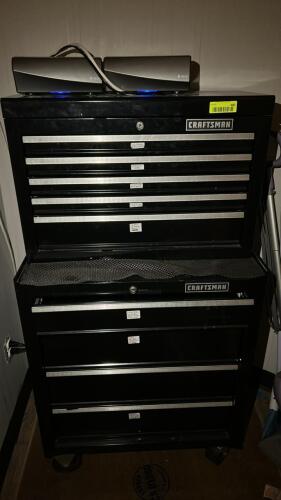 CRAFTSMAN BLACK ROLLING TOOL CHEST AND CABINET COMBO WITH MULTIPLE DRAWERS, LOCKING TOP CHEST, AND LOWER CABINET ON CASTERS. FEATURES METAL DRAWER PULLS AND SIDE HANDLES. CONTENTS NOT INCLUDED.