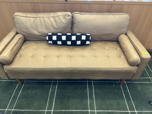 70" TAN LEATHER SOFA WILL ARM REST PILLOWS.