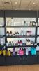 2 SECTIONS OF LIGHTED RETAIL SHELVING WITH 4 SHELVES AND BOTTOM COVERED STORAGE - 2