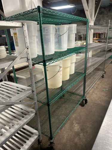 48" X 24" FOUR TIER COATED WIRE SHELF.