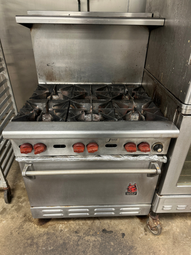 WOLF SIX BURNER RANGE WITH LOWER CONVECTION OVEN.