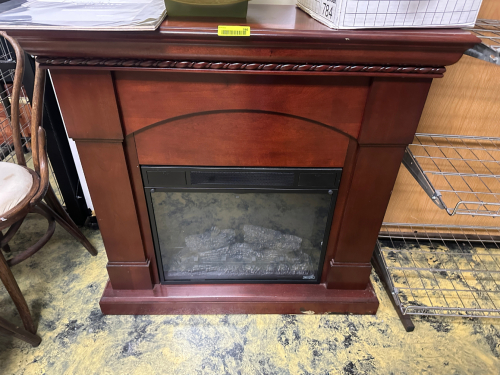 ELECTRONIC FIREPLACE HEATER W/ WOODEN MANTLE SURROUND.