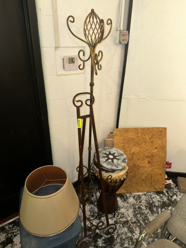 EASEL, COAT RACK, AND BROKEN DRUM.