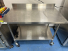 REGENCY 48" X 30" STAINLESS TABLE W/ BACK SPLASH.