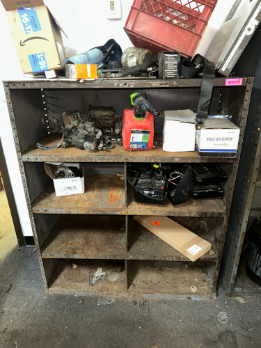 SHELF AND CONTENTS - ASSORTED HARDWARE, TOOLING, AND PARTS.