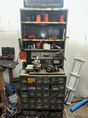 SHELF AND CONTENTS - ASSORTED HARDWARE, TOOLING, AND PARTS.